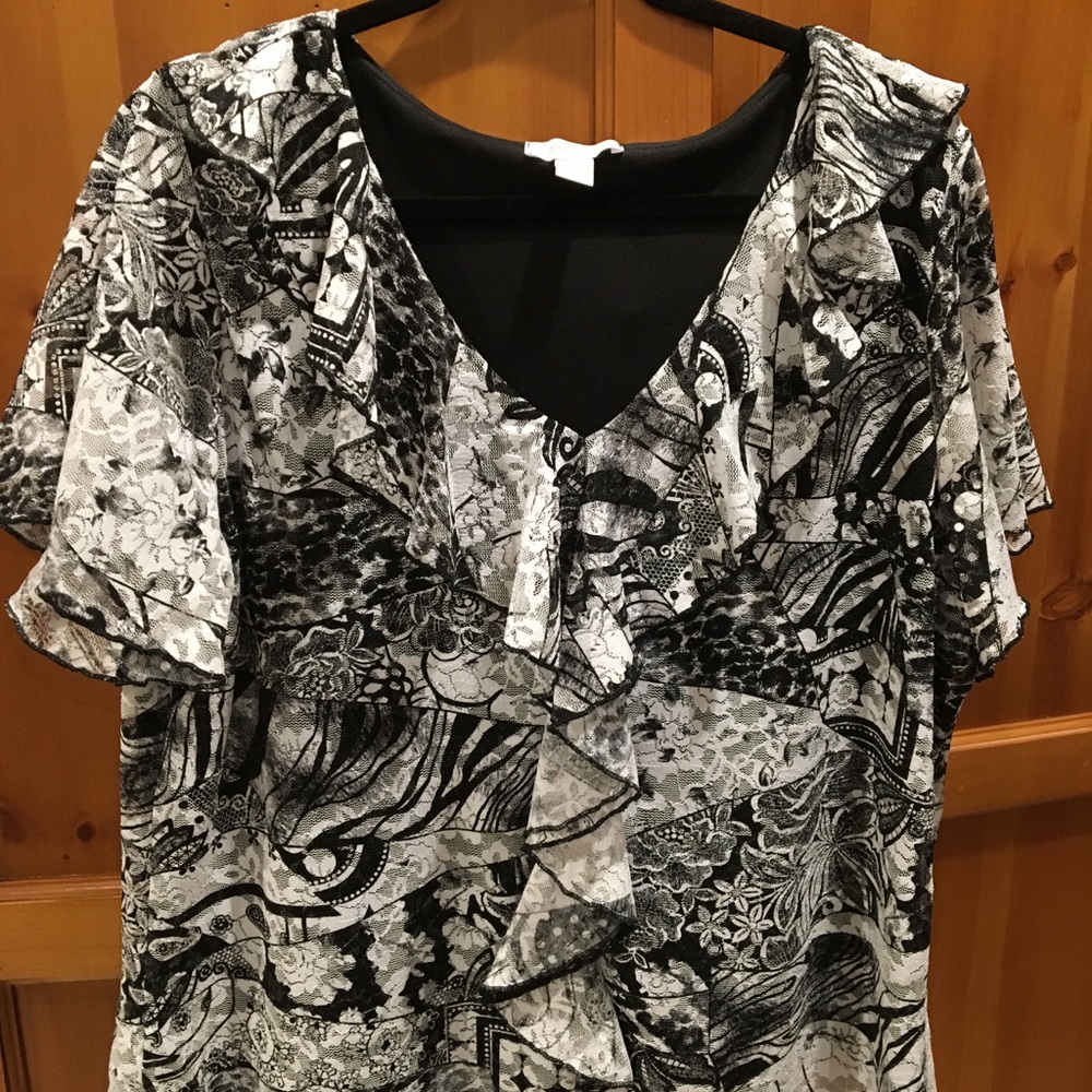 Black & white blouse with ruffled neck.